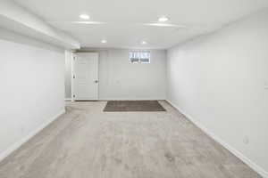 Below grade area featuring carpet flooring and recessed lighting