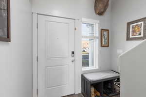 Entrance foyer featuring wood finished floors