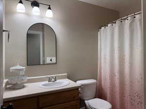 Full bath featuring vanity and a shower with curtain