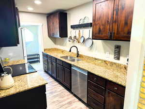 Granite countertops, updated cabinets, stainless steel appliances, updated plumbing fixtures, and wood flooring.
