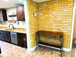 Granite countertops, updated cabinets, stainless steel appliances, updated plumbing fixtures, and wood flooring.