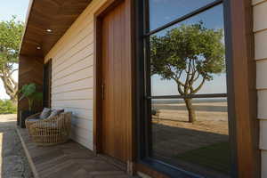 Doorway to property with a water view