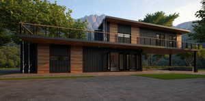 View of front facade featuring a mountain view and a balcony