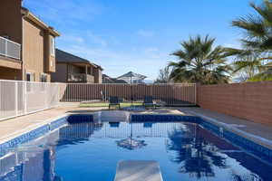 View of swimming pool with a patio area
