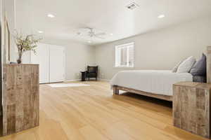 Bedroom with light wood-style flooring, recessed lighting, a ceiling fan, and a closet