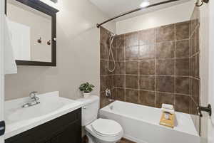 Bathroom with shower / bathtub combination and vanity