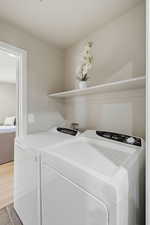 Laundry area featuring washing machine and clothes dryer