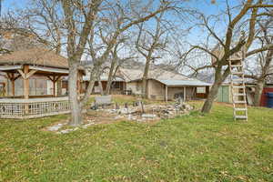 View of green lawn featuring a patio area, a gazebo, and an outdoor structure