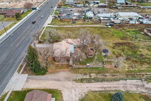 Aerial view of property's location featuring nearby suburban area and a nearby body of water