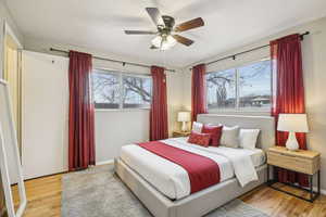 Bedroom featuring light wood-type flooring and ceiling fan