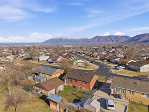 Aerial perspective of suburban area with a mountain backdrop