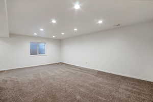 Spare room with recessed lighting and carpet floors