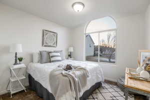 Carpeted bedroom with baseboards
