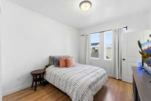 Bedroom with light wood-style floors