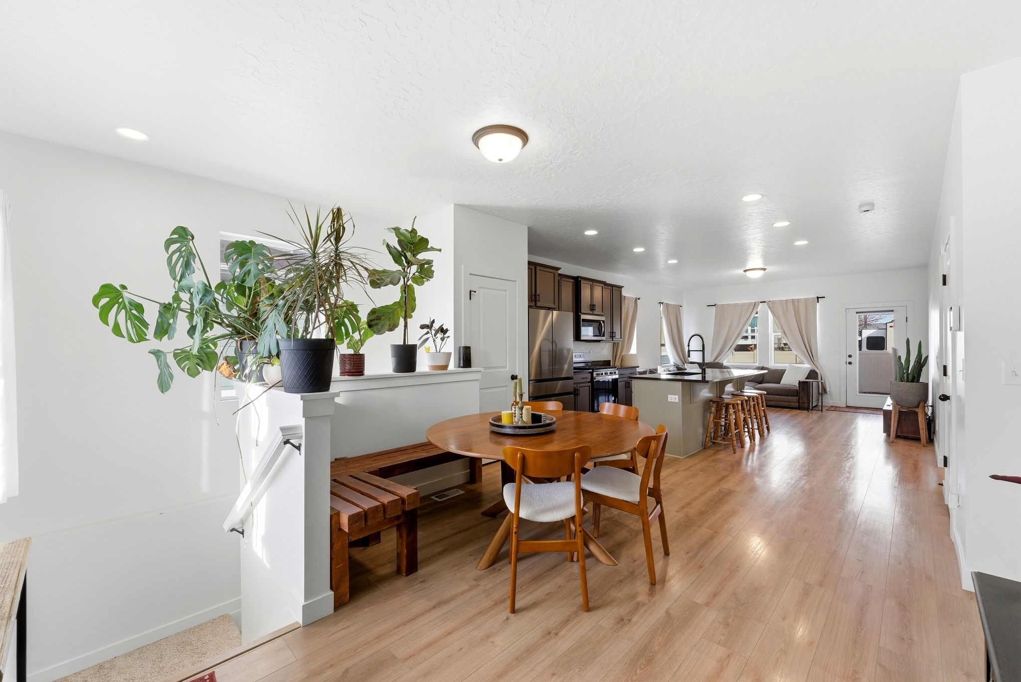 Dining space with recessed lighting and light wood-style flooring