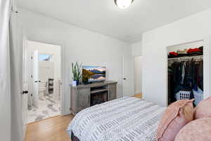 Bedroom featuring a closet and light wood-style floors