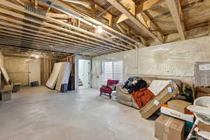 Basement featuring stairs