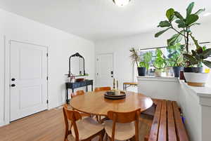 Dining area featuring wood finished floors
