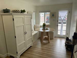 Dining area with light wood-type flooring