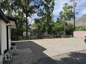 Fenced backyard with a patio area and a mountain view