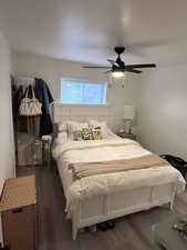 Bedroom with wood finished floors and ceiling fan