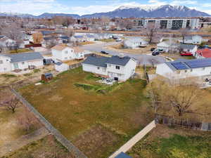 Aerial perspective of suburban area featuring a mountainous background