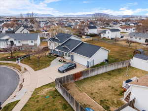 Aerial view of residential area featuring a mountain backdrop