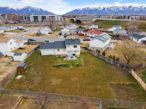 Aerial view of residential area featuring a mountain backdrop