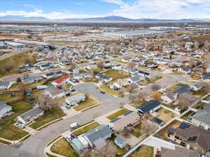 Aerial view of residential area featuring a mountainous background