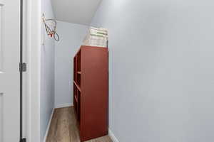 Corridor featuring baseboards and light wood-type flooring