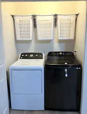 Washroom featuring independent washer and dryer