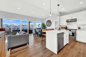View of patio / terrace with an outdoor hangout area, a mountain lake view