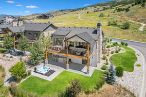 Vies from back side of the home and open space behind it