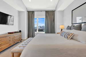 Primary Bedroom featuring a mountain view, lofted ceiling, carpet floors, and recessed lighting