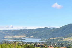 Aerial overview of property's location with a mountain backdrop and Pineview off of the deck