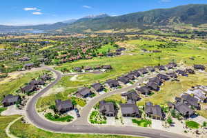Bedroom with light colored carpet and baseboards