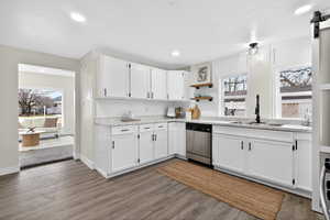 Kitchen featuring white cabinetry, dishwasher, open shelves, healthy amount of natural light, and recessed lighting