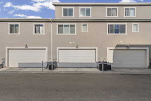 Back of house featuring stucco siding