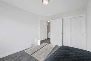 Bedroom featuring a closet and carpet flooring