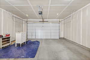 Garage featuring a garage door opener
