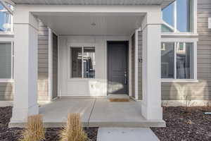 Entrance to property featuring a porch