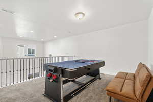 Rec room with carpet floors and recessed lighting