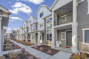 Exterior space featuring board and batten siding and a residential view