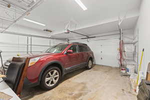 Garage featuring a garage door opener