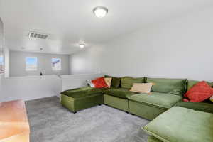Living area with carpet and baseboards