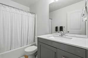 Full bathroom with vanity and shower / tub combo with curtain