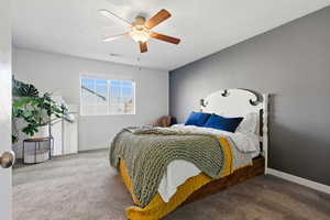 Bedroom with carpet floors and a ceiling fan