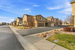 View of asphalt street with a residential view