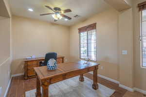 Office area with dark wood finished floors, a ceiling fan, and recessed lighting