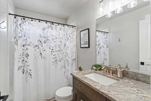 Full bath with vanity and toilet